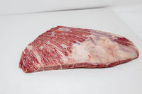 Well Marbled Kosher Wagyu Lifter Meat on a white surface. 