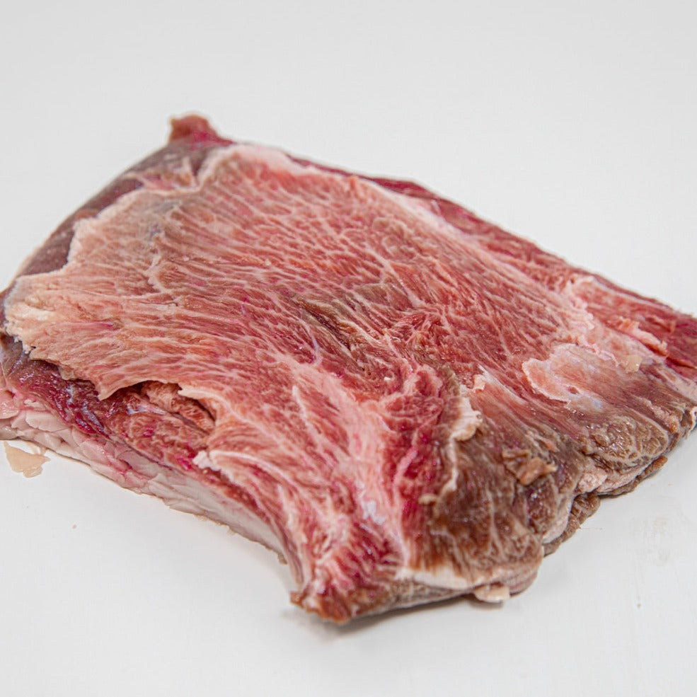 Kosher Fullblood American Wagyu beef cheeks available at Chu's Meat Market, elegantly presented on a marble countertop.